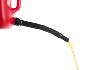 Pouring of motor oil from canister against white background
