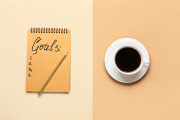 Notebook with empty to do list and cup of coffee on color background. New year goals