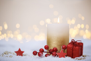 Christmas or new year candle with festive ornaments