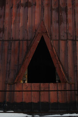 Fototapeta na wymiar Triangular hole in attic roof 
