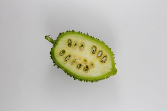 Sliced Spiny gourd or kakrol green vegetable isolated on white background