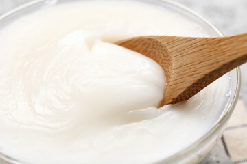 Bowl of lard spread on table, closeup