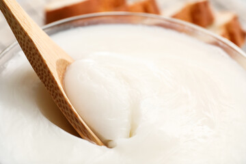 Bowl of lard spread on table, closeup