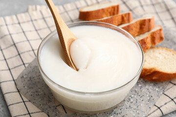 Bowl of lard spread on table