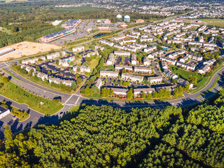 Aerial views of residential area, roads, parks and shopping areas.