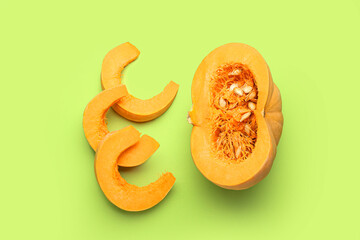 Ripe cut pumpkin on color background