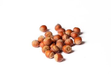Shelled hazelnuts on the white background