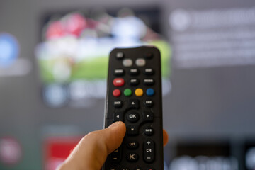 Man hand browse smart tv apps,zapping channels on leisure lockdown time,home lifestyle