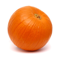 Round orange pumpkin isolated on white background