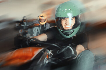 Fototapeta na wymiar Glad cheerful woman driving sport car for karting in a circuit lap in sport club