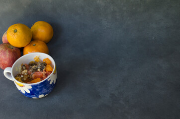 fruit salad in flowery cup. tropical breakfast