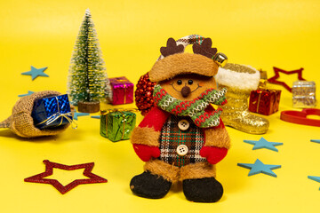 .Ornament Santa Claus boot on yellow background with christmas elements.