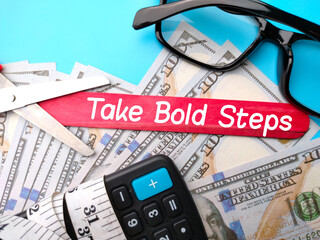 Calculator,measuring tape,glasses,banknotes and colored ice cream stick written with text Take Bold...