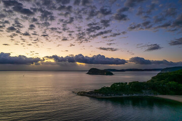 Fototapeta na wymiar Aerial sunrise seascape with clouds