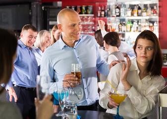Portrait of woman rejecting man on corporate party