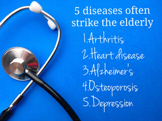 Stethoscope with text 5 diseases often strike the elderly on a blue background. Healthcare concept.