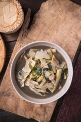 Northeastern Thai food, Spicy bamboo shoot soup with pork and vegetables eating with sticky rice, Local Thai food