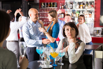 Portrait of woman tired during corporate party