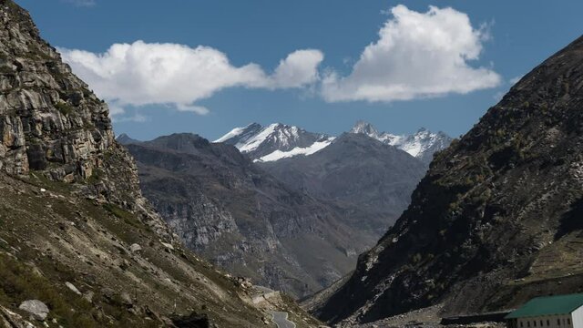Time lapse of snow mountains. clouds moving on snow mountains. Outside View of atal tunnel, Himachal Pradesh, India.