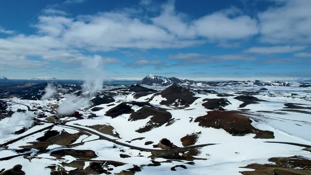 Northern Iceland Ring Road with snowy mountain Road by Krafla Viti Lake Myvatn