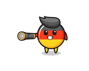 Naklejka premium germany flag mascot holding flashlight