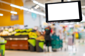LCD television screen in the supermarket blur people at cashier. - obrazy, fototapety, plakaty