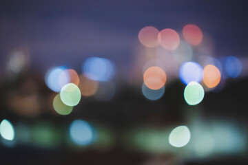 Retro toned blurred street lights, urban abstract background.