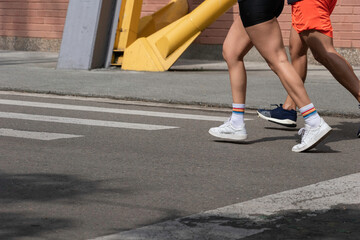 Fototapeta na wymiar Close-up of legs of people doing exercise
