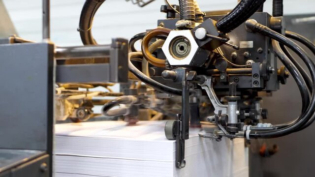 Printing machine print paper in typography. Rapidly moving through conveyor. Fake news concept