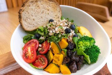 a salad meal with fruit and vegetables