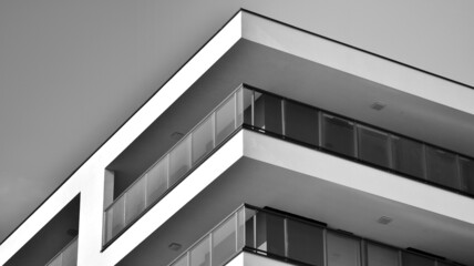 Obraz premium Modern apartment building. Modern urban architecture and details of building facade. Black and white.