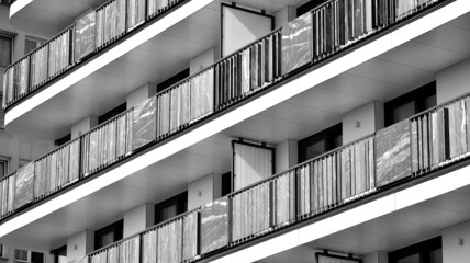 Modern apartment building. Modern urban architecture and details of building facade. Black and white.