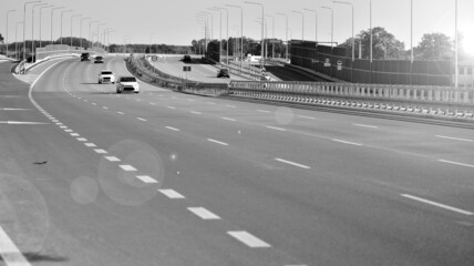 View on a concrete highway. Modern highway safety markings on concrete. Black end white.
