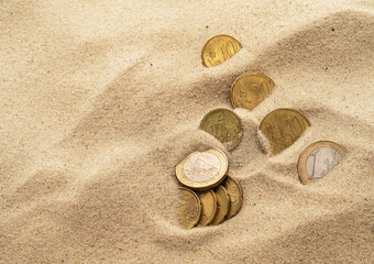Lost coins in the sand, treasure chest concept