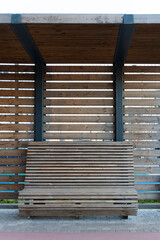 wooden benches for relaxing under a wooden canopy