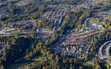 Residential Homes in Maple Ridge City in Greater Vancouver, British Columbia, Canada. Aerial View from Airplane. Sunny Fall Season.