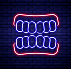 Glowing neon line Dentures model icon isolated on brick wall background. Teeth of the upper jaw. Dental concept. Colorful outline concept. Vector