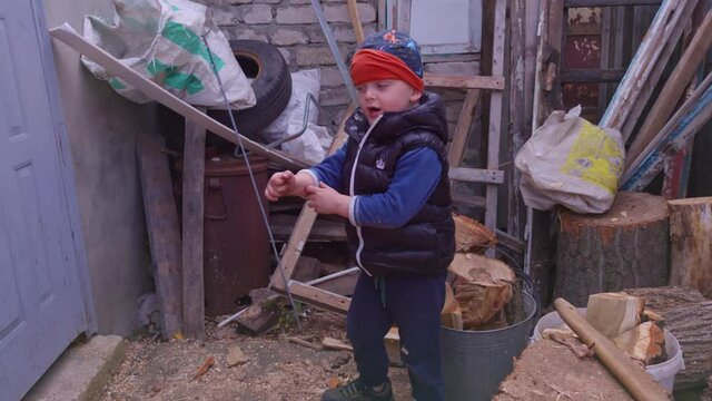 Boy looking for exit from barn