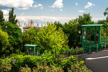 Fototapeta na wymiar Funicular in Odessa near the Potemkin Stairs. Green trailers on the rails.