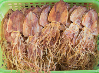 Many dried squid are sold in sea food market.