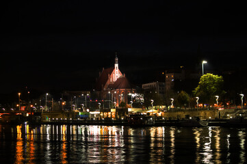 Fototapeta na wymiar the historic parish of St. John the Evangelist seen at night, Szczecin, Poland