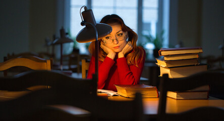 quiet calm atmosphere in the library dim light personal lamp