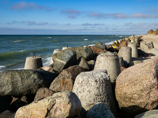 Breakwater and tetrapods by the sea 
