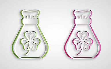 Paper cut Money bag with clover trefoil leaf icon isolated on grey background. Happy Saint Patricks day. National Irish holiday. Paper art style. Vector