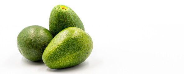 Avocado on a white background. Combined with the shade of ripe avocado. Empty space for text. copy space
