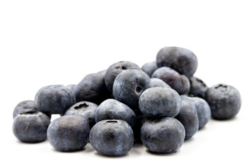 Blueberries on a white background. In combination with the shade of ripe blueberries. close up