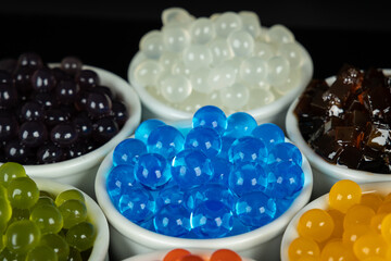 Different tapioca pearls for bubble tea.  Bubble tea ingredients arrangement in bowls