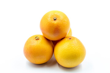 Grapefruit on a white background. Along with the ripe Grapefruit shade. close up