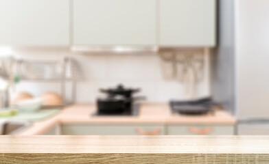 Kitchen table background. Wooden table in the interior of a home kitchen during the day. Food, cooking, groceries mockup