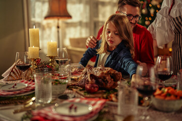 Father and son during Christmas lunch at home